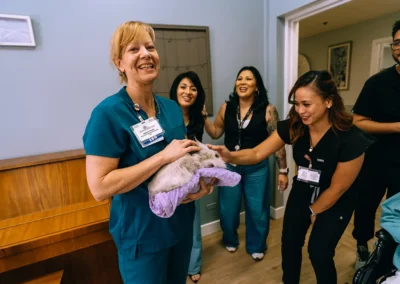 A nurse holding a bunny Glendale Healthcare Center