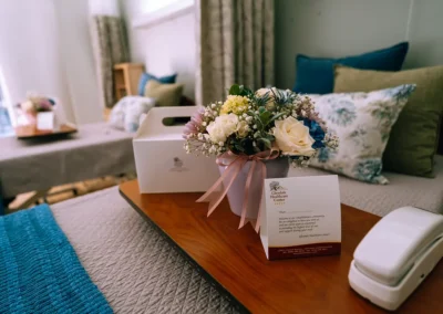 A vase of flowers on a residents bedside at Glendale Healthcare Center