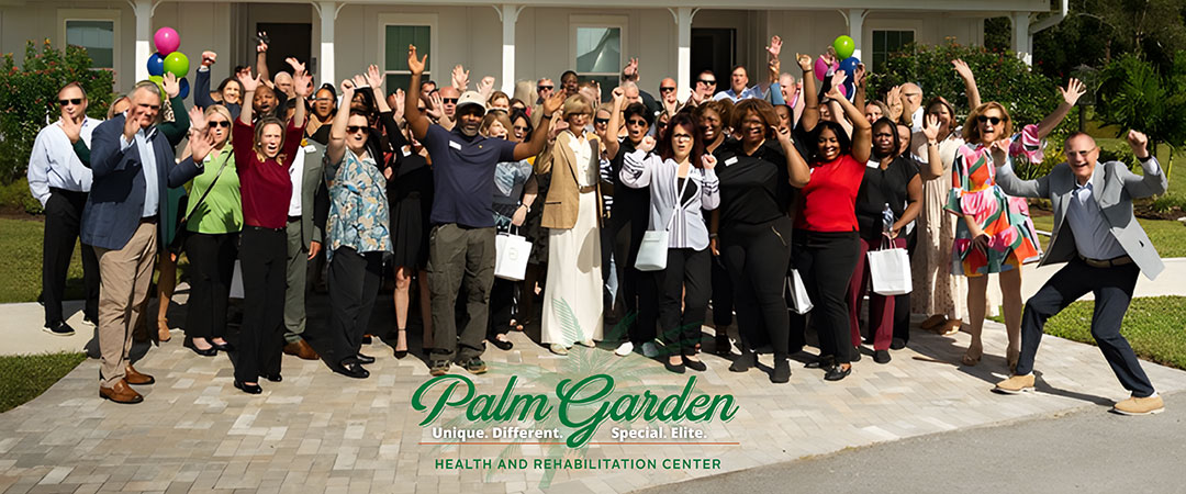 The Palm Garden Leadership team is excitedly cheering together outside of a facility.