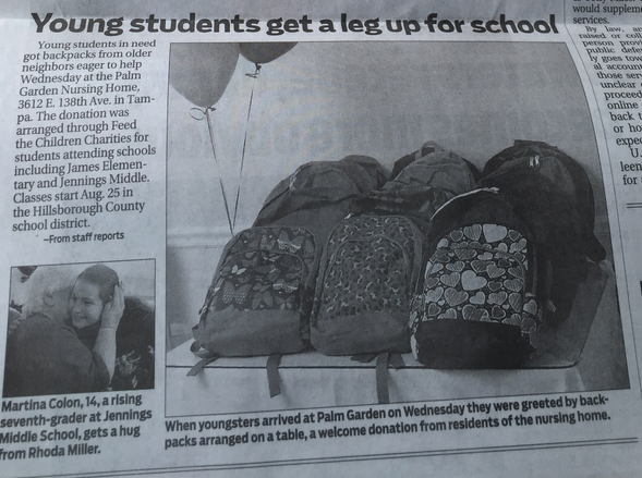 Newspaper article about backpack donations