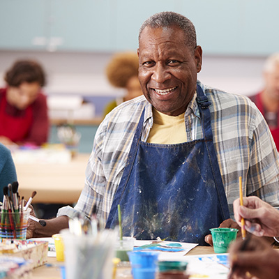 happy man in a painting class