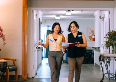 Two employees walking through the hall at Valley Palms