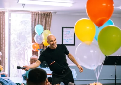 An employee with a microphone at an event at Valley Palms
