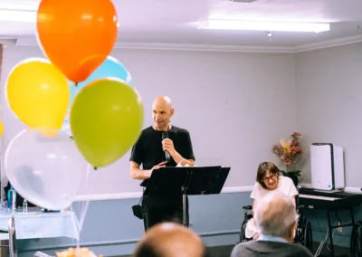 An employee speaking at an event at Valley Palms
