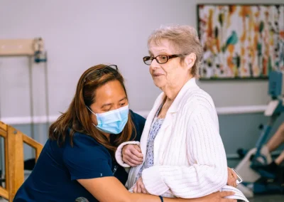 An elderly woman doing physical therapy with a therapist Valley Palms