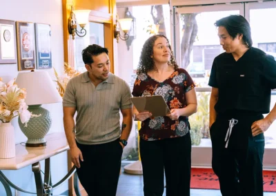 Three employees of Valley Palms walking and talking