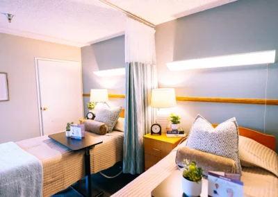 Two beds with plants at the bedside at Valley Palms