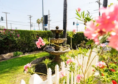 A fountain and flowers at Valley Palms