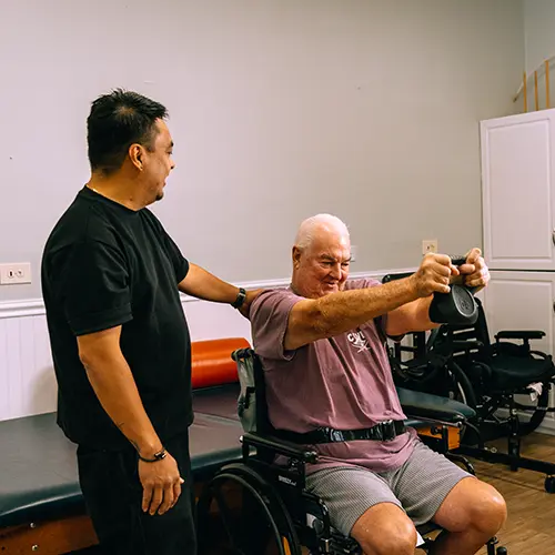 An elderly man doing physical therapy