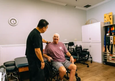 An elderly man with a physical therapist at Casitas Care Center
