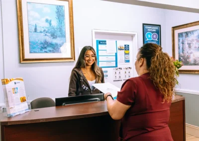 Two employees at the front desk at Casitas Care Center
