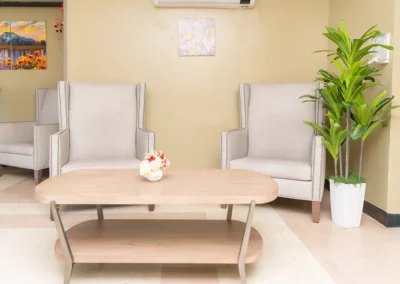 Two chairs and a table in the lobby of Hickory Village
