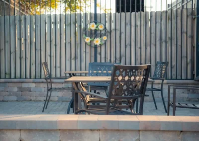 A table and chairs outside of Hickory Village