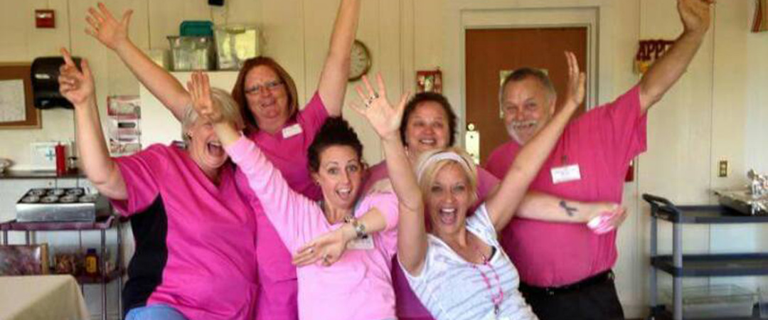 New Castle Social Service Team Laughing and Smiling For a Photo