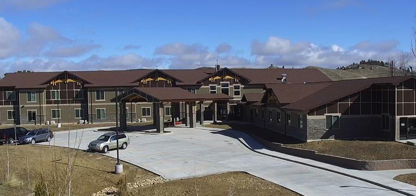 The front of the Mountain lodge facility in the day