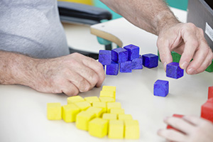 Resident stacking blocks as physical therapy