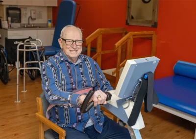 Senior using a rehabilitation machine at the Farmington Village Nursing and Rehabilitation Center