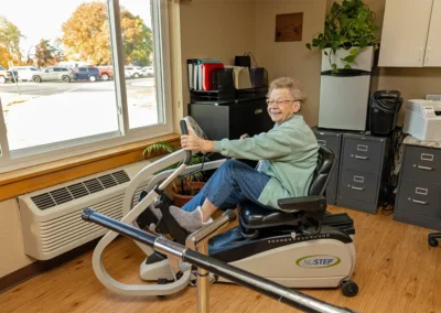 Senior using the rehabilitation bike at the Farmington Village Nursing and Rehabilitation Center