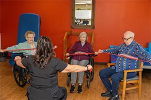 farmington-2025-300×200-1 Rehabilitation session at the Farmington Village Nursing and Rehabilitation Center with trees