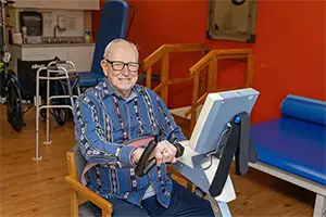 farmington-2025-300×200-3 Senior using a rehabilitation machine at the Farmington Village Nursing and Rehabilitation Center