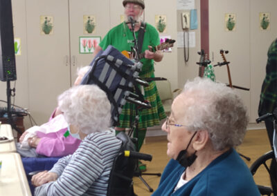 A singer for Saint Patrick’s Day serenading residents on the microphone