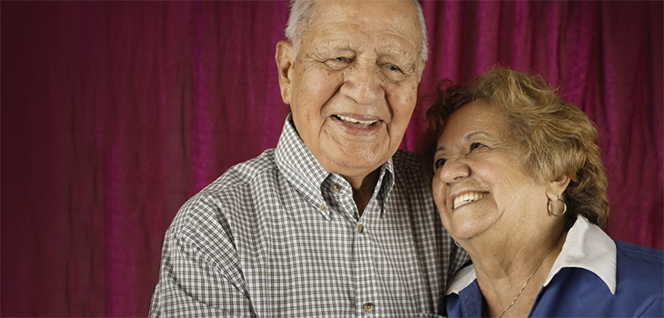 A senior couple laughing together.